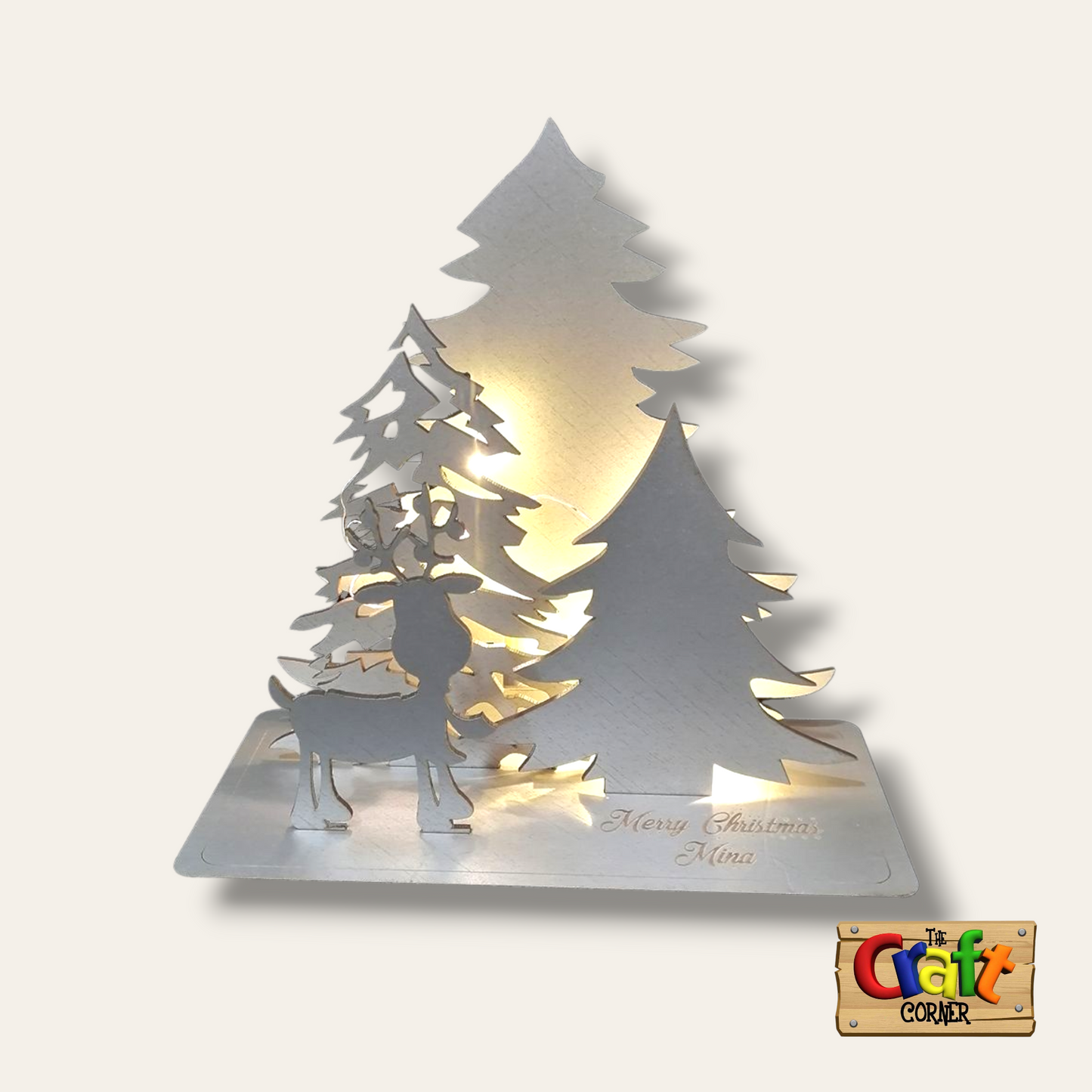 Lighted Christmas tree and reindeer wooden stand