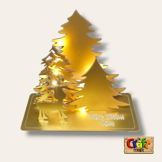 Lighted Christmas tree and reindeer wooden stand